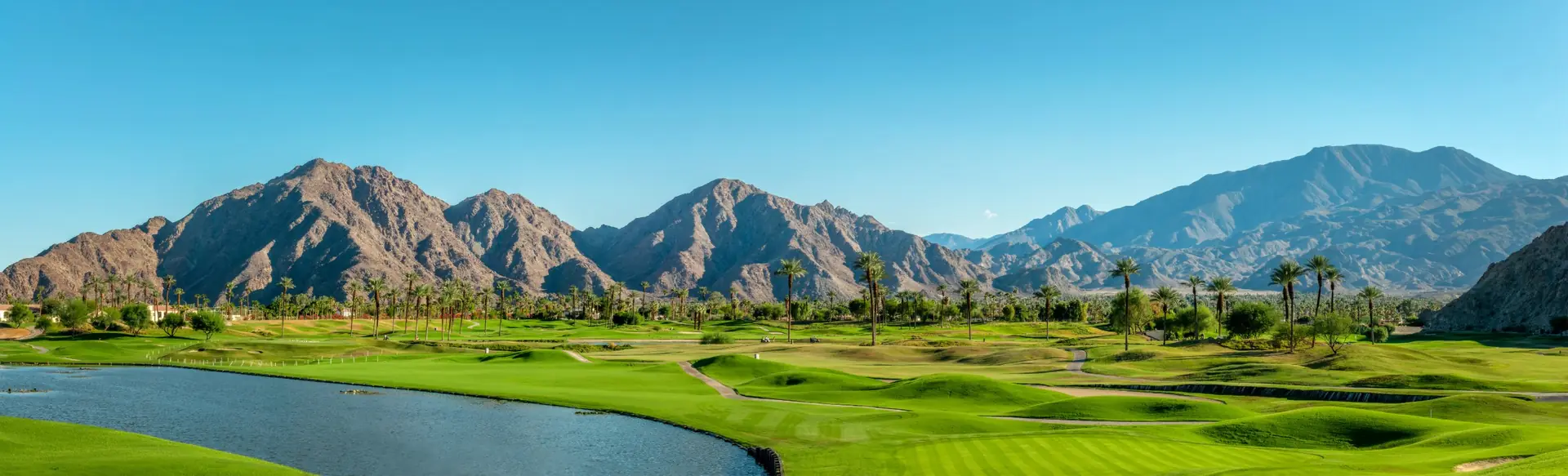 Desert mountains above green fairways and palm trees, banner for child and teen therapy by telehealth