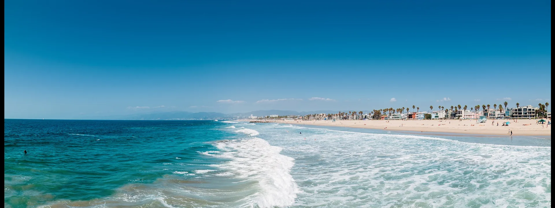 Sunlit beach with rolling surf, banner for depression therapy by telehealth